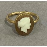 An Edward VII shell cameo ring in 15ct gold by Spilling Brothers, the oval female portrait collet