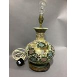 A Chinoiserie pottery table lamp with integral wood base, 35cm to fitting