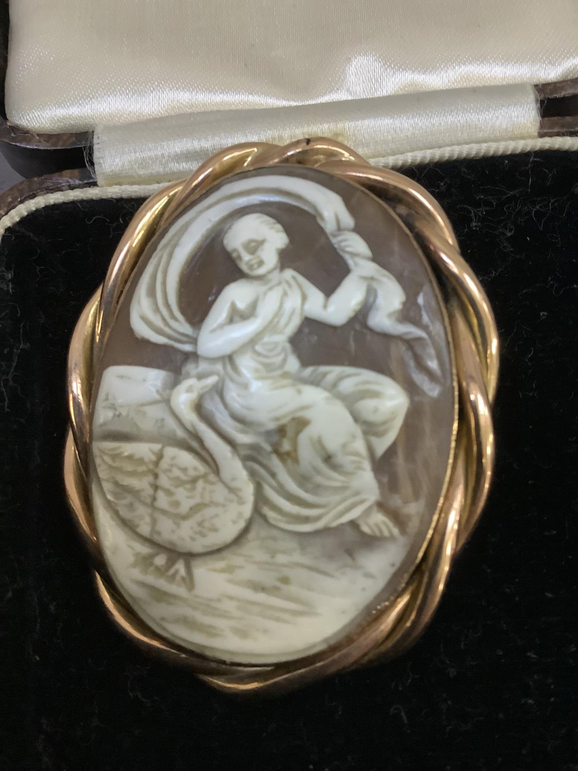 A Victorian shell cameo brooch in 9ct rose gold, the oval portrait of Leda and the swan collet set - Image 2 of 2