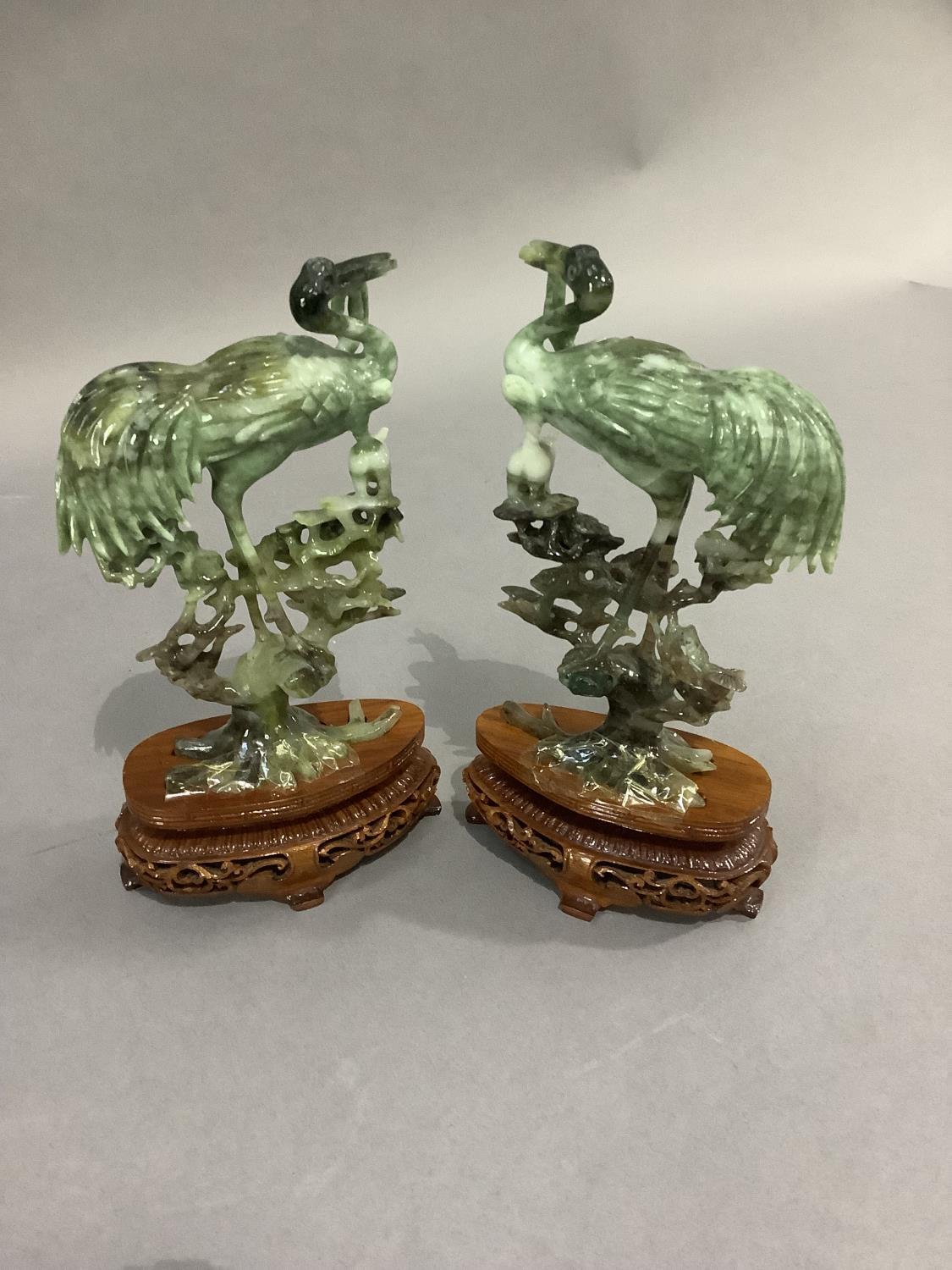A pair of Chinese polished hardstone figures of an egret and cat in the branches of a pine tree, - Image 3 of 4