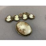 An early 20th century shell cameo bracelet, the graduated oval female portraits collet set in rolled
