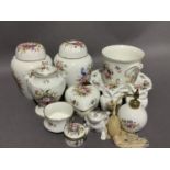 A pair of Hammersley china ginger jars and covers, a two handled lidded vase and domed cover, a