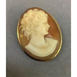 A mid-late 20th century shell cameo brooch, the contemporary female portrait collet set, raised
