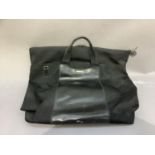 A Gucci style black travel bag