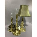 Three various gilt metal or brass table lamps with one shade