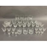 A quantity of cut glass table ware, various designs including wine glasses, whisky tumblers,