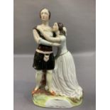 A 19th century Staffordshire pottery figure group of Romeo and Juliet, on naturalistic base, 27cm