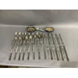 A suite of silver plated cutlery for 8 comprising dinner knives and forks, dessert knives, spoons