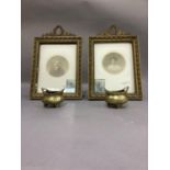 A pair of gilt photograph frames with laurel wreath cresting and riband frames and a pair of small