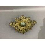 A Victorian gilded cast iron two handled dish inset to the centre with a printed and coloured view