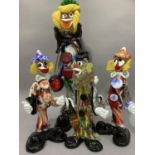 Four Murano glass clowns in coloured and marbled glass, 34cm and 22cm high