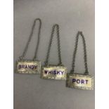 A set of three modern silver and blue enamelled spirit labels for whisky, port and brandy