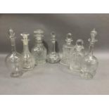 Seven various 19th century and later cut glass and etched decanters (chips)