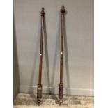 A Victorian mahogany stained curtain pole with quantity of rings, with turned knop finials, 180cm