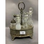 A Victorian silver plated breakfast cruet fitted with seven cut glass bottles, loop carrying