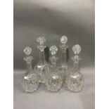 A set of five early Victorian glass decanters with facetted necks and bodies, two measuring 31cm and