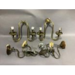 A pair of Edwardian brass twin wall lights on scrolled arms, the drop 33cm by 41cm wide overall, gas