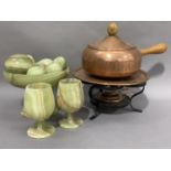 A copper fondue set of pan and burner together with an onyx pedestal bowl with six onyx eggs and a