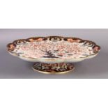 A Derby Crown Porcelain Co. large tazza of petal shaped circular form decorated in Imari palette