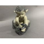 A Royal Copenhagen figure of a faun with snake entwined around his arm, No.1712, 12.5cm high
