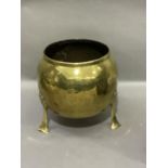 A late Victorian brass planter of rounded form on three stylised plant form feet, 26.5cm high