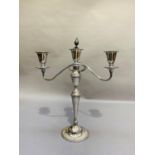 A plated on copper three light candelabrum with baluster column and reeded scroll twin arms,