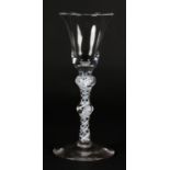 A MID 18TH CENTURY WINE GLASS with bell bowl on a double knopped and double opaque twist stem on