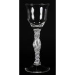 AN 18TH CENTURY STYLE WINE GLASS with tulip bowl on a baluster double opaque twist stem with tear,