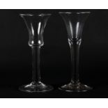 A MID 18TH CENTURY WINE GLASS with bell bowl on a plain stem and conical folded foot 15.5cm and a