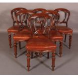 A SET OF SIX LATE VICTORIAN MAHOGANY DINING CHAIRS, having an open back, close nailed red hide,