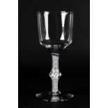 A MID 18TH CENTURY WINE GLASS with half fluted bowl on a double series opaque airtwist stem with