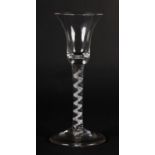 A MID 18TH CENTURY WINE GLASS with bell bowl on a mercury single series spiral cable stem and