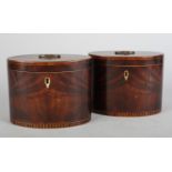 A PAIR OF GEORGE III MAHOGANY, ROSEWOOD AND BOXWOOD INLAID TEA CADDIES, c.1800, of oval outline, the