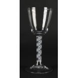 AN 18TH CENTURY DUTCH WINE GLASS with rounded funnel bowl, double opaque twist stem on a conical