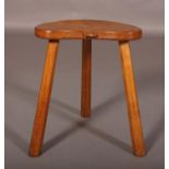 THOMPSON OF KILBURN 'MOUSEMAN', a kidney shape stool on three chamfered legs, carved in relief