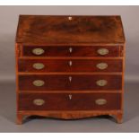 A GEORGE IV FIGURED MAHOGANY BUREAU having a fall front, the interior fitted with an arrangement