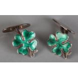 A PAIR OF SHAMROCK ENAMELLED SILVER CUFFLINKS BY DAVID ANDERSEN, the green guilloche faces on an