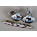 A PAIR OF SILVER AND ENAMEL CUFFLINKS AND TIE SLIDE BY DAVID ANDERSEN, the guilloche and black