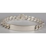 AN IDENTITY BRACELET BY TIFFANY, in silver, the central plain bar flanked by facetted curb links