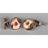 A PAIR OF STAFFORDSHIRE BULL TERRIER ENAMEL CUFFLINKS IN SILVER, the round faces collet set with a