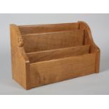 THOMPSON OF KILBURN 'MOUSEMAN', an oak stationery rack of three divisions carved in relief with a