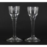A PAIR OF MID 18TH CENTURY WINE GLASSES each with ogee bowl engraved with grapevine, on a plain stem
