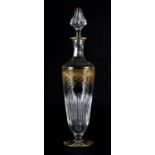 A ST LOUIS CRYSTAL DECANTER of shouldered and tapered form, cut with slender oval panels beneath