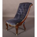 A VICTORIAN MAHOGANY NURSING CHAIR, button upholstered in blue velvet, foliate carved framed and