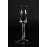 A MID 18TH CENTURY WINE GLASS with waisted bucket bowl on a mercury single series twist on a conical