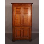 A 19TH CENTURY OAK CORNER STANDING CUPBOARD, having a moulded cornice and mahogany frieze, two