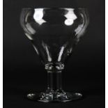 A MID 18TH CENTURY GLASS GOBLET with double ogee bowl on a plain stem and foot, 15cm