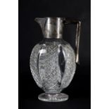 A VICTORIAN SILVER MOUNTED CUT GLASS CLARET JUG, John Grinsell & Sons, Birmingham 1890 of oval flask