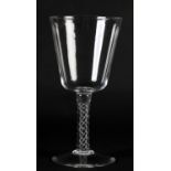 A LARGE GLASS GOBLET with rounded funnel bowl on an airtwist stem and conical foot, 20cm