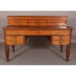 A MID VICTORIAN FIGURED MAHOGANY ESTATE DESK, the superstructure having six drawers with brass bar